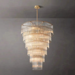 Chandelier with multiple tiers of glass shades on a gray background
