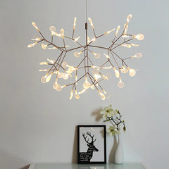 Modern chandelier with multiple light bulbs on a neutral background