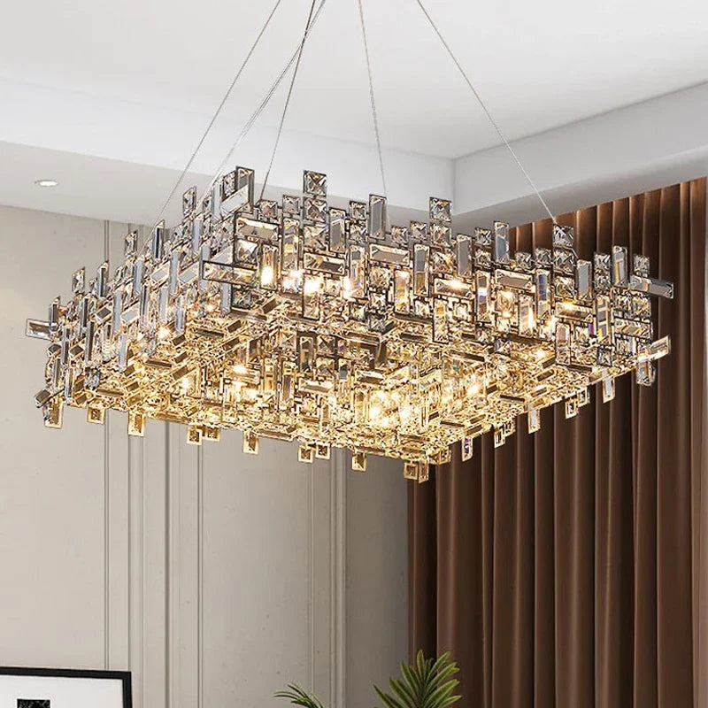 A view of the polished chrome crystal chandelier from a slightly lower angle, highlighting its rectangular form and faceted crystal details.