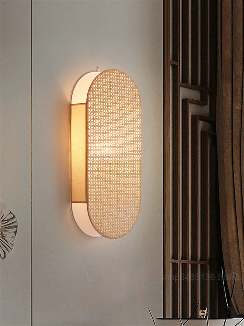 Modern wall light fixture on a neutral wall with decorative elements.