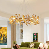 Gold leaf ring chandelier with leaf-shaped shades, illuminating a modern living room.
