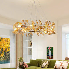 Gold leaf ring chandelier with leaf-shaped shades, illuminating a modern living room.