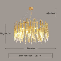 Gold chandelier with dimensions on a gray background