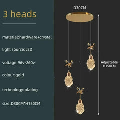 Gold pendant light fixture with specifications on a dark background