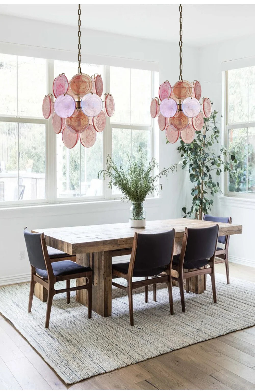 Dining room with floral pendant lights, wooden table, and chairs.