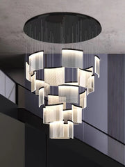 Modern chandelier hanging from a ceiling with a geometric design.