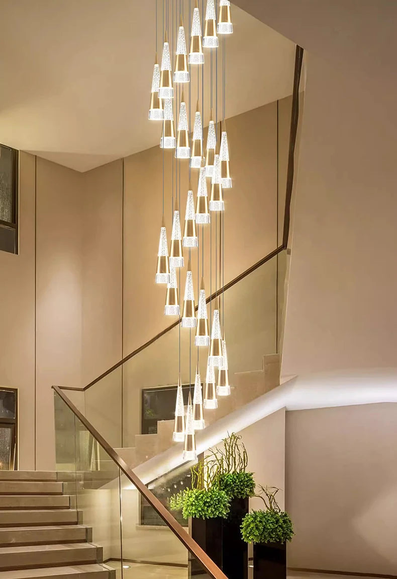 Modern staircase with a decorative light fixture in a well-lit interior setting.