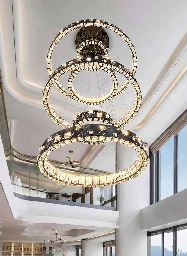 Luxurious chandelier hanging from a ceiling in a modern interior setting.