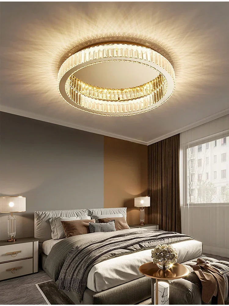 Interior view of a living room with a gold ring crystal ceiling light fixture illuminating the space.