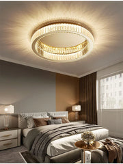 Interior view of a living room with a gold ring crystal ceiling light fixture illuminating the space.