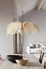 Modern interior design with a large floral pendant light in a living room.