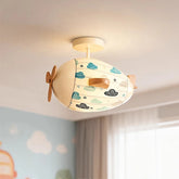 Ceiling light shaped like an airplane with a fabric shade featuring a cloud pattern, mounted on a white ceiling.