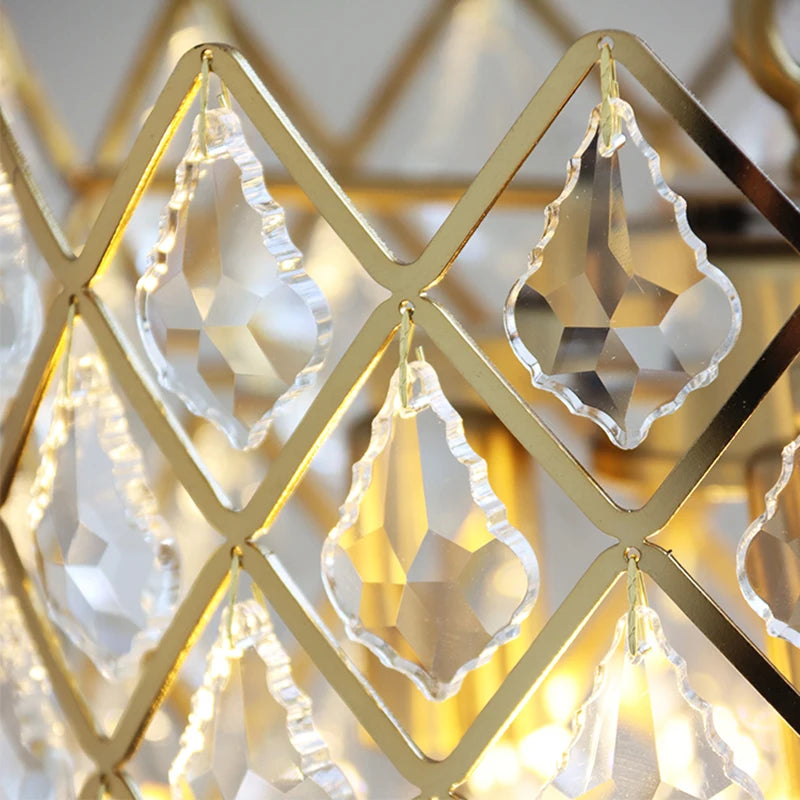 Close-up of gold-framed crystal earrings with a blurred background