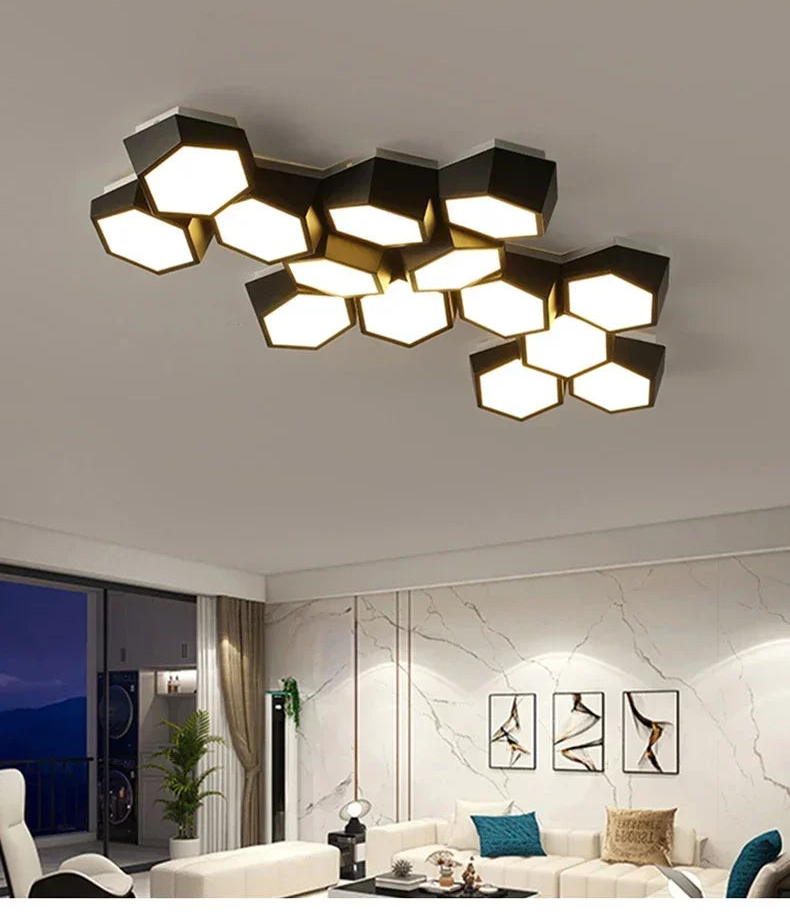 Modern ceiling light fixture with geometric design in a living room setting.