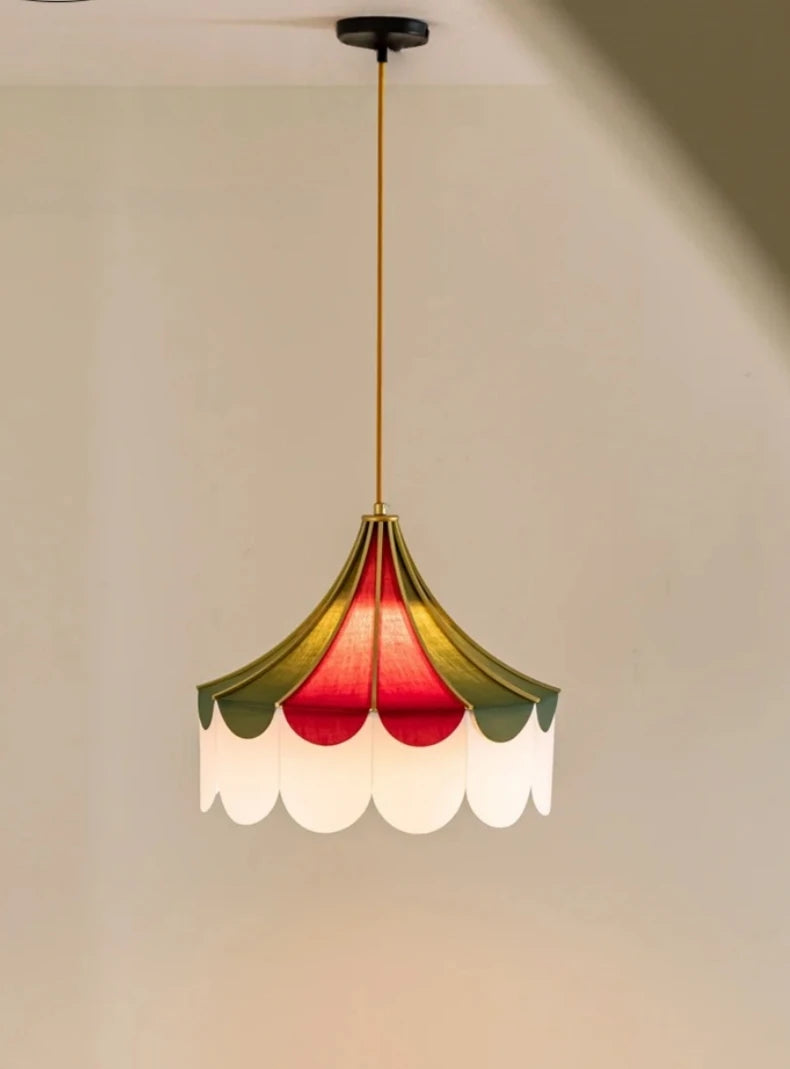 Ceiling light fixture with colorful lampshade on a plain background