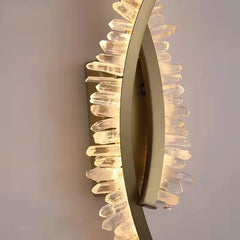 Modern wall light fixture with a decorative design on a neutral background