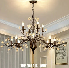 Chandelier hanging in a room with 'The Nordic Light' branding.