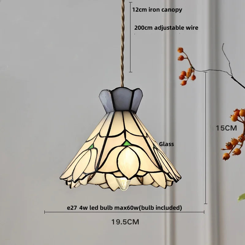 Pendant light with stained glass shade and measurements on a gray background