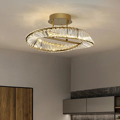 Modern ceiling light fixture with crystal accents in a room setting.