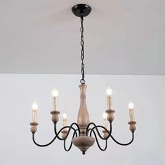 Wooden chandelier with black metal accents on a white background
