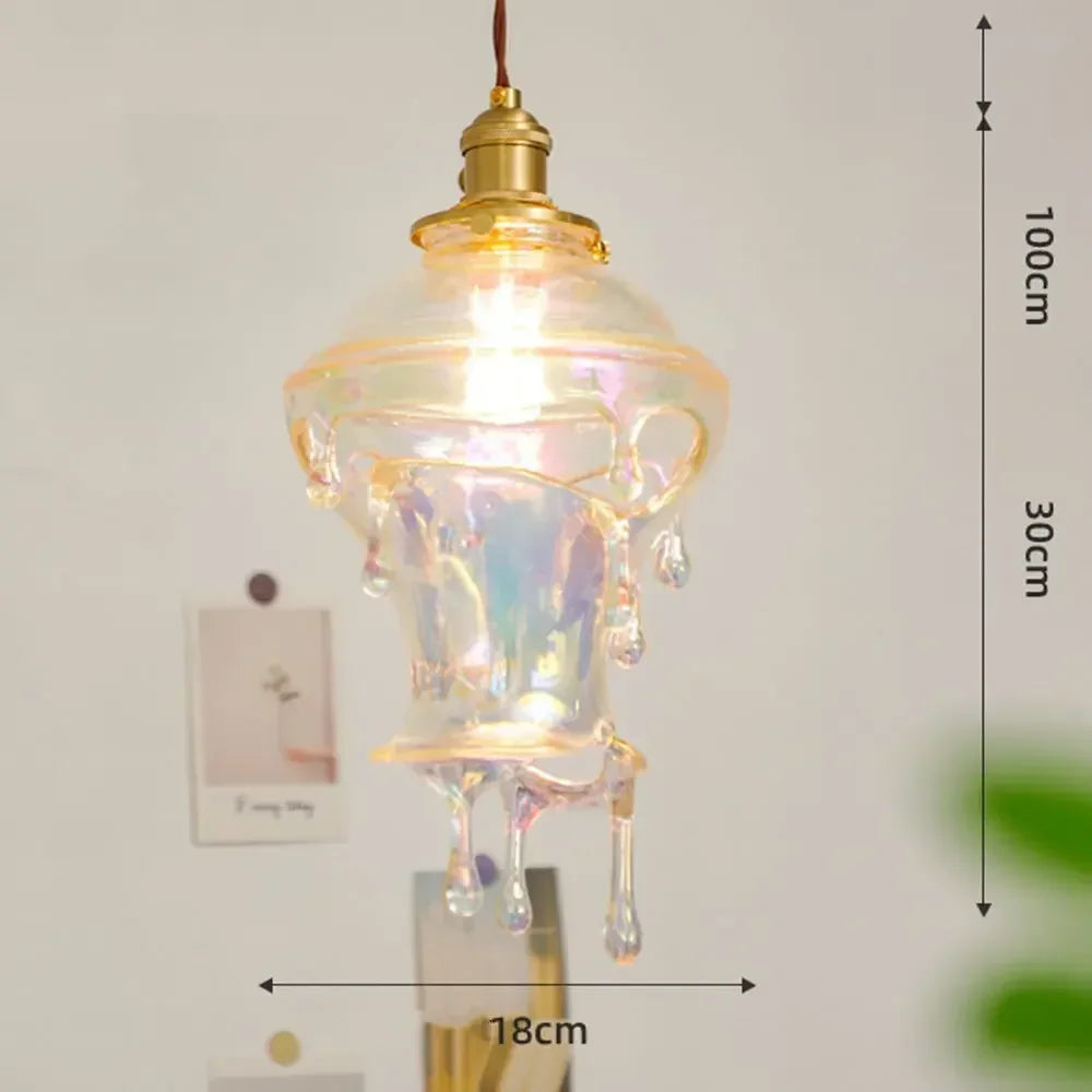 Decorative pendant light with measurements on a plain background
