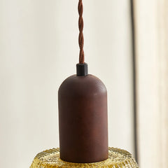 Brown pendant light fixture on a neutral background
