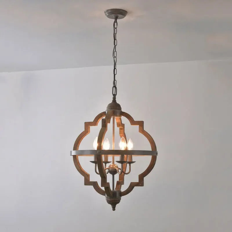 Decorative ceiling light fixture hanging against a plain wall.