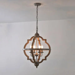 Decorative ceiling light fixture hanging against a plain wall.
