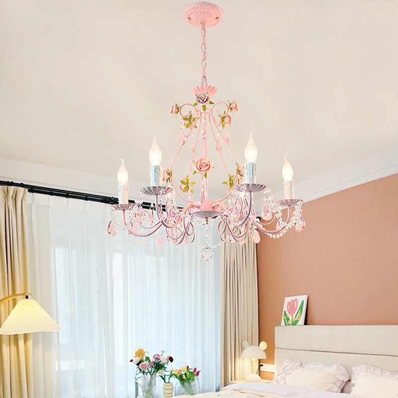 Pink semi-flush mount chandelier with crystal flower accents and hanging crystal droplets, installed in a bedroom.