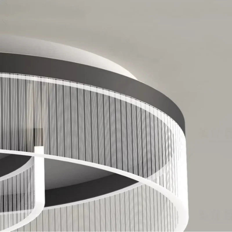 Detail of the layered ring design and brushed finish on the modern ceiling light.
