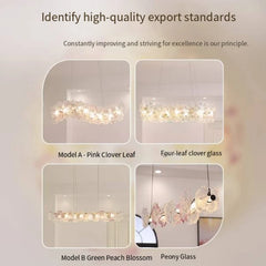 Chandelier with pink clover leaf design on a light gray background