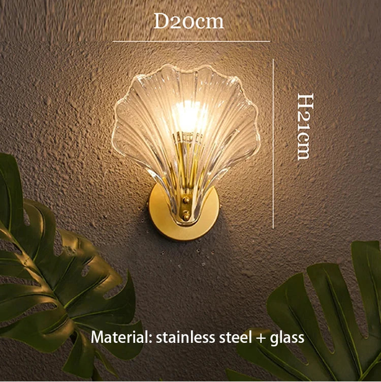 Shell-shaped wall light fixture with dimensions and material details on a textured wall background.