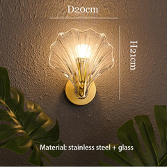 Shell-shaped wall light fixture with dimensions and material details on a textured wall background.