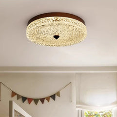 Ceiling light fixture in a room with decorative flags