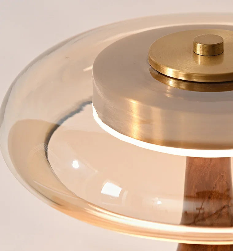 Close-up of a gold and glass object on a white background