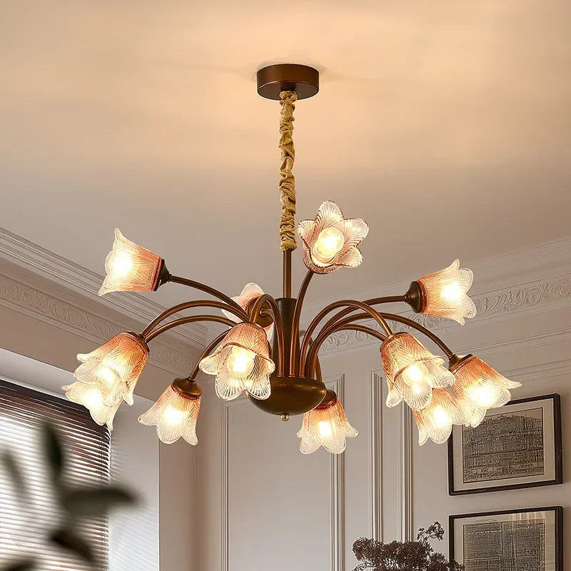 Close-up view of the bronze floral bud chandelier pendant light, highlighting the glass shades.