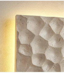 Textured Stone Geometric Wall Sconce with Backlight Illumination