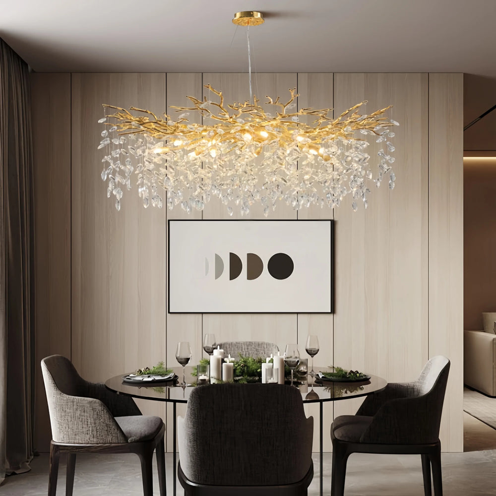Modern dining room with a decorative chandelier, table, chairs, and wall art.