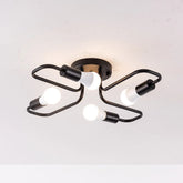 Black metal starburst semi-flush ceiling light fixture with four exposed LED bulbs