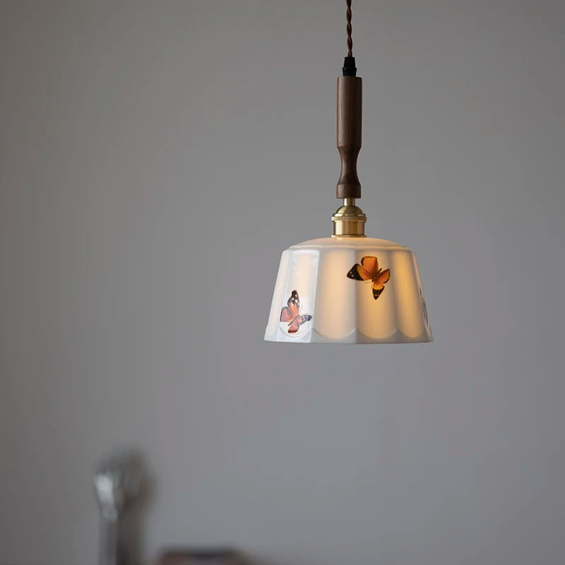 Pendant light with decorative shade on a gray background