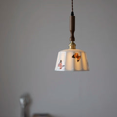 Pendant light with decorative shade on a gray background