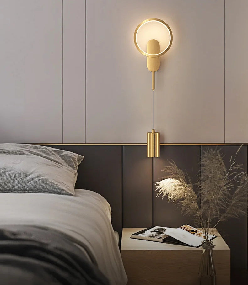 Modern bedroom with a wall-mounted lamp and a nightstand.