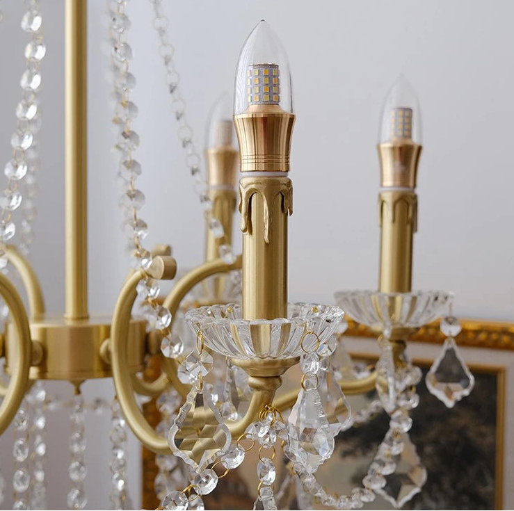 Gold chandelier with crystal accents and 'YITEMAS' branding.