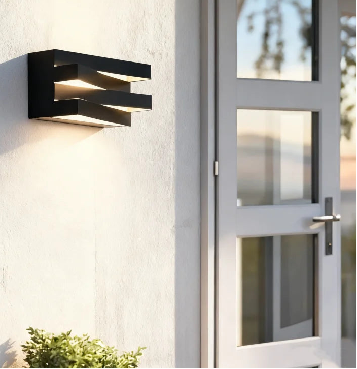Modern outdoor wall light fixture on a building exterior.