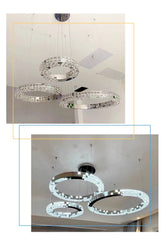 Crystal chandelier hanging from a ceiling with close-up details.