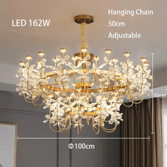 Gold chandelier with crystal accents in a room setting, showing dimensions and LED power rating.