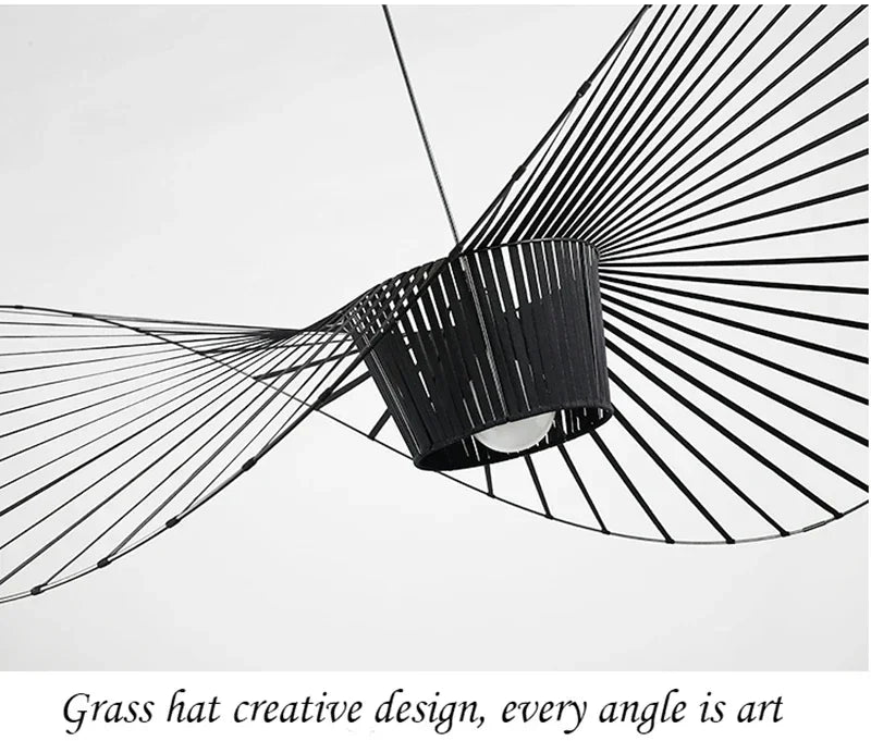 Black decorative item with fan-like design on a white background