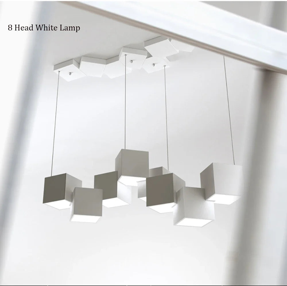 Modern pendant light fixture with eight square lampshades on a white background
