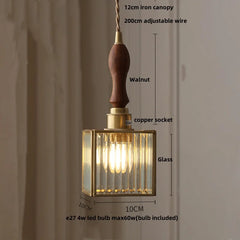 Pendant light with wooden canopy and glass shade, featuring measurements and material details.