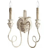 Decorative wall sconce with two candles on a white background
